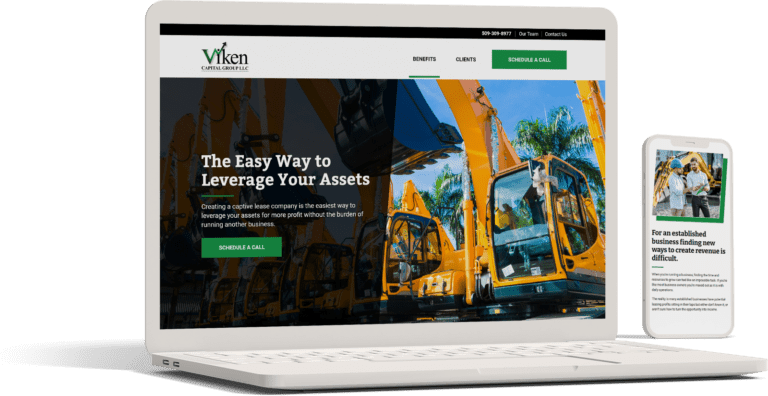A laptop and mobile phone displaying the website of Viken Capital Group, LLC, featuring images of heavy machinery.